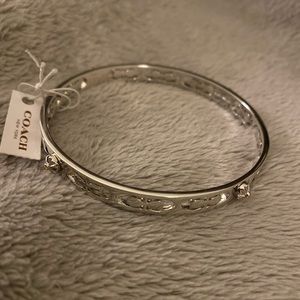 Coach Daisy Rivet Pierced Kissing C Bangle
$95